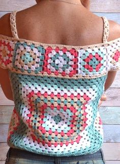 the back of a woman's shoulder bag with crochet