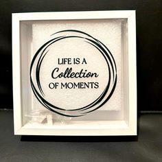 a black and white frame with the words life is a collection of moments in it