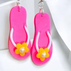 Finally-flip flops you can wear year round! No frozen toes with these fun, neon pink flip flop earrings! Made from lightweight resin and comfortable, hypoallergenic ear wires. Accented with a tiny iridescent rhinestone.  * Measure 2" long and about 1/2" wide Resin is hard to break but does scratch easily. Keep your resin pieces safe from jewelry box bullies by storing in the original packaging, or in a plastic bag. Pink Flip Flops, Colored Rope, Earrings Beach, Earrings Summer, Custom Pens, Beautiful Pen, Summer Earrings, Cute Eyes, Summer Earring