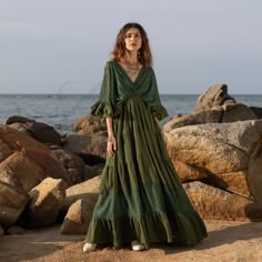 ZinniaPearl  ✨ Embrace your inner goddess with the enchanting Lunette Seagrass lace kaftan! ✨ This stunning boho chic maxi dress is perfect for destination weddings, beach elopements, vacations, or any special occasion. Imagine yourself walking barefoot on the sand, the soft lace flowing around you, feeling confident and carefree. The plunging V neckline, dramatic tiered lace skirt, and ruffled sleeves create a look that's both elegant and effortless. This flowy maternity gown is also perfect for engagement photoshoots, ensuring you look and feel your best. Crafted with love and attention to detail, each Lunette dress is ethically handmade using luxurious lace with a vintage Italian-inspired touch. The elastic smocked waist and flowing silhouette flatter a variety of body types and allow f Wedding Dress Boho Chic, Boho Chic Maxi Dress, Concert Dress, Lace Kaftan, Chic Maxi Dress, Maxi Dress Boho Chic, Dress Boho Chic, Weddings Beach, Concert Dresses