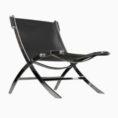 a black leather chair with metal legs and an armrest that is bent to the side