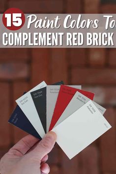 someone is holding up some paint colors to color the brick wall with text overlay that reads, 15 paint colors to complement red brick walls