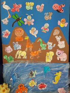 a bulletin board with animals and butterflies on it