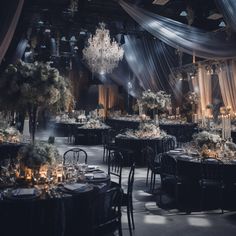 an elegant ballroom with chandeliers and tables