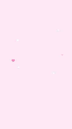 two giraffes standing next to each other on a pink background with hearts