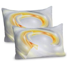 two white and yellow pillows with an orange swirl on the front, one is square