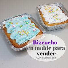 two pans filled with cake sitting on top of a table