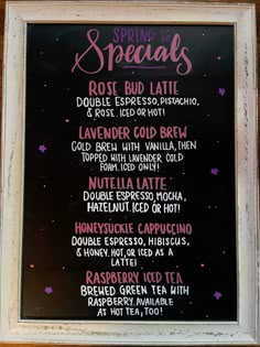 the menu for spring specials is displayed in front of a blackboard with pink writing