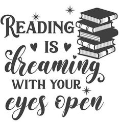 the words reading is dreaming with your eyes open and stacked on top of each other