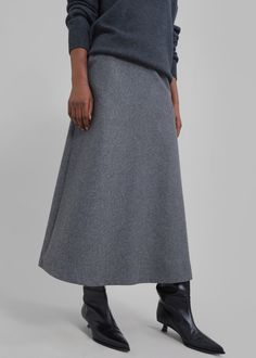 Color: Grey Midweight wool blend fabric Midi length A-line silhouette Front pockets Concealed partial side zip closure Partially lined 45% Wool 38% Polyester 17% Rayon Dry Clean By The Frankie Shop. Imported A Line Wool Skirt, Grey Midi Skirt Outfit Winter, Midi Grey Skirt Outfit, Grey Long Skirt, Clothing Campaign, Gray Skirt Outfit, Midi Skirt Outfit Winter, A Line Skirt Outfits, Corduroy Midi Skirt