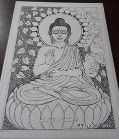 a drawing of buddha sitting on top of a table