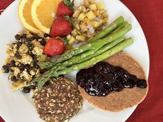 a white plate topped with fruit and veggies