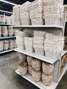 baskets are stacked on shelves in a store