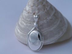 "Handcrafted Locket Pendant, made of Solid pure .925 Sterling Silver.The Pendant is encrusted with one gentle 4 mm Round Natural White Freshwater Pearl. High quality Hand polished without scratches as cheap jewelry. High Quality Hand polished Finish without scratches as cheap jewelry. The Natural Freshwater Pearl are stunning,and the Solid .925 Sterling Silver. Would be great gift for your little girl . Great for younger and teenage fans. Locket opens to contain your favorite picture. The Pendan H2o Locket, H2o Just Add Water Mermaids, Pearl Locket, H2o Just Add Water, Mermaid Pendant, Favorite Picture, White Freshwater Pearl, Natural Pearl, Cheap Jewelry