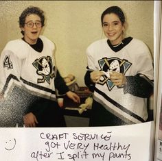 two women in hockey jerseys are posing for a picture with their name written on them