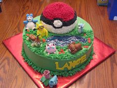 a birthday cake decorated with pokemon characters