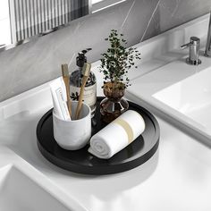 a bathroom sink with soap, toothbrushes and toiletries on it in front of a mirror