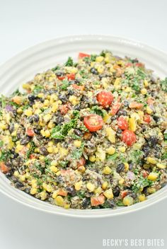 a white bowl filled with corn and black beans