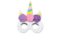 a white mask with pink flowers and a unicorn's horn on top of it