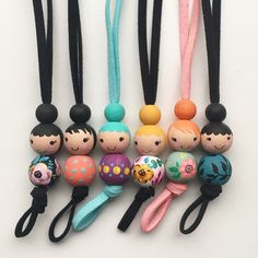 a group of different colored beads on black cord with mickey mouse and minnie mouse heads