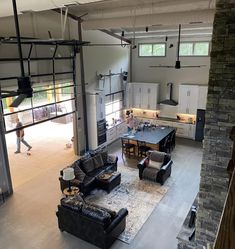 an overhead view of a living room and kitchen