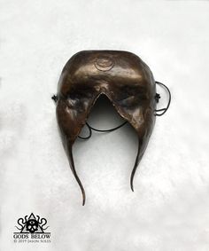 "This sightless bronze mask was designed for ritual application. The mask is 7.5\" long and 5.25\" wide. It features a warm liver sulfur and ferric nitrate patina. The mask hangs on a leather cord." Crow Skull, Skull Pendant, The Mask, Leather Cord, Ritual, Sculpture Art, Seattle, Patina, Art Collection