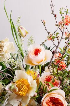 a bunch of flowers that are sitting on a table