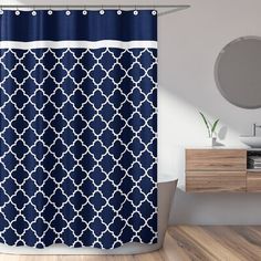 a blue and white shower curtain in a bathroom