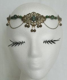 "This beautiful circlet has peridot beads, gold plated accent beads, gold plated chain, gold plated side accent pieces and gold plated pendant with peridot setting. 20\" long can be adjusted to 24\". Lobster clasp." Elegant Handmade Costume Jewelry, Bronze Jewelry With Historical Design For Wedding, Vintage Jeweled Ceremonial Jewelry, Handmade Gold Costume Headpiece, Ornate Antique Gold Jewelry With Historical Design, Costume Gold Metal Jewelry, Handmade Gold Headpiece For Costume, Handmade Gold Headpieces For Costume Occasion, Gold Handmade Headpiece For Costume