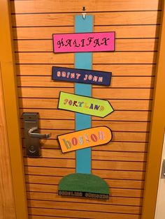 a door decorated with different colored signs