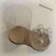 two clear bowls with wooden spoons in them on a white counter top next to each other