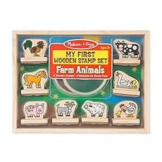 a wooden stamp set with farm animals on it's front and the words, my first wooden stamp set