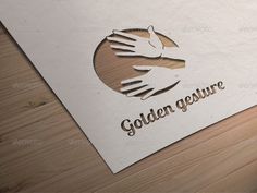 a close up of a paper on a table with a hand and the words golden gesture