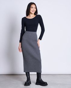 BEST SELLING SKIRT Hi EBBA! The skirt has a ribbed texture and a rather tight fit. It features an elastic waistband for the comfort and is midi-length and rather high waisted. The slit in the back is not only for your own mobility but also functions as a nice little fashion twist.Wear it with a casual cropped jumper or spice up a white tee with this midi skirt. EBBA is not only your companion for spring and summer. It's the perfect skirt for layering in fall and winter too. EBBA is made of 100% Ribbed Skirt Outfit, Long Black Skirt Outfit, Long Tight Skirt, Gray Skirt Outfit, Midi Knit Skirt, Leon Black, Long Grey Skirt, Knit Skirt Outfit, Black Skirt Outfits