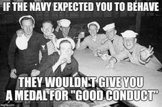 a group of men sitting around a table with an caption that reads, if the navy expected you to be brave they wouldn't give you a medal for good conduct