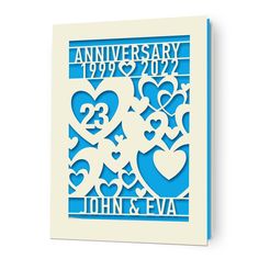 a blue and white anniversary card with hearts