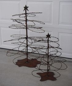 a wire christmas tree with stars on it