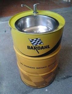 a yellow barrel with a sink in it