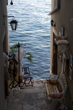 an open door leading to the water