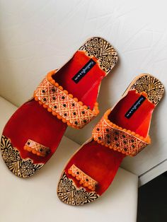 Orange embossed and Beaded Boho Style Kolhapuri Chappals/Sandals for Women, Shoes for Women, Women Flats, Slip Ons, Indian Ethnic flop flip, Royal shoes, traditional style Women, Wedding Shoes, Bridal Shoes, Orange Kolhapuri Chappals, Boho Sandals, Leather Sandals, Boho wedding sandals, Women Flats, Indian Sandals, Boho Barefoot Sandals An enticing and comfortable pair of Indian slippers. Must have in your shoe collection. Contemporary sandals which will compliment every kind of outfit. PERFECT Wedding Sandals With Zari Work For Festivals, Closed Toe Sandals For Wedding And Festive Occasions, Festive Closed Toe Sandals For Wedding, Festive Wedding Sandals With Zari Work, Wedding Sandals With Zari Work For Summer, Flat Sandals For Summer Festivals, Traditional Closed Toe Wedding Sandals, Festive Flat Sandals For Summer, Traditional Wedding Sandals With Zari Work