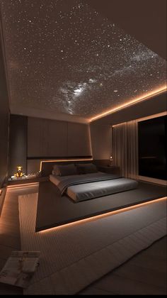 a large bed sitting under a sky filled with stars