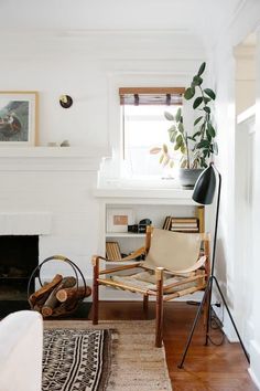 a living room filled with furniture and a fire place