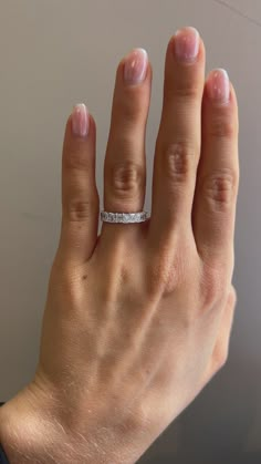 a woman's hand with a ring on it