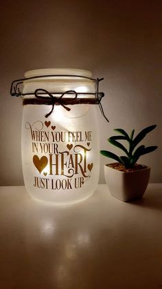 a jar with a light that says when you tell me, in your heart just look up