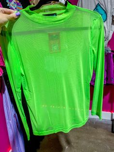 Get meshed out in this long sleeve neon green top. The perfect blend of solid color and funky mesh, this top adds a touch of playfulness to any outfit. Stay cool and stylish in this statement piece. 96% POLYESTER 4% SPANDEX Trendy Club Tops With Mesh Sleeves, Trendy Tops With Mesh Sleeves For Club, Green Sheer Mesh Top, Fall Club Mesh Top With Long Sleeves, Sheer Green Mesh Top, Long Sleeve Mesh Top For Club In Fall, Long Sleeve Club Tops For Spring, Long Sleeve Tops For Club In Spring, Long Sleeve Spring Club Tops