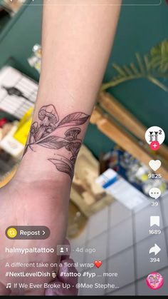 a person with a flower tattoo on their arm