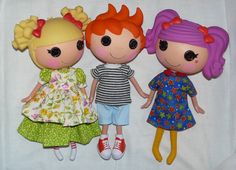 three dolls are standing next to each other