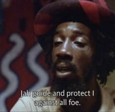 a man wearing a hat with the words, jah guide and protect i against all fo