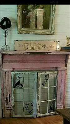 an old window is painted pink and has birds on the glass doors that lead to it