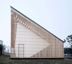 the building is made out of wood and has an interesting pattern on it's side